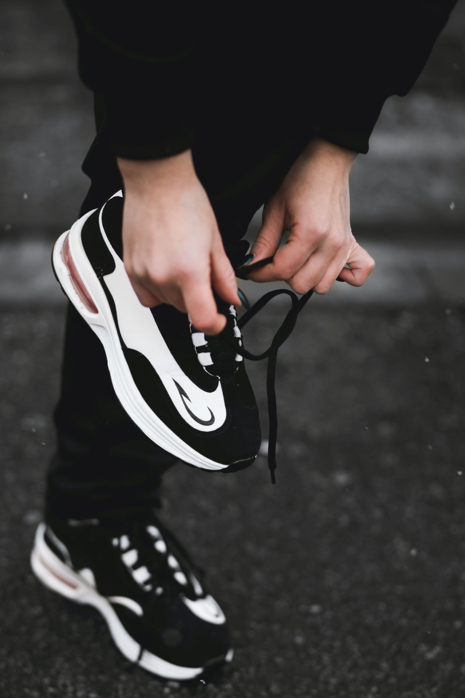 Runner tying shoes